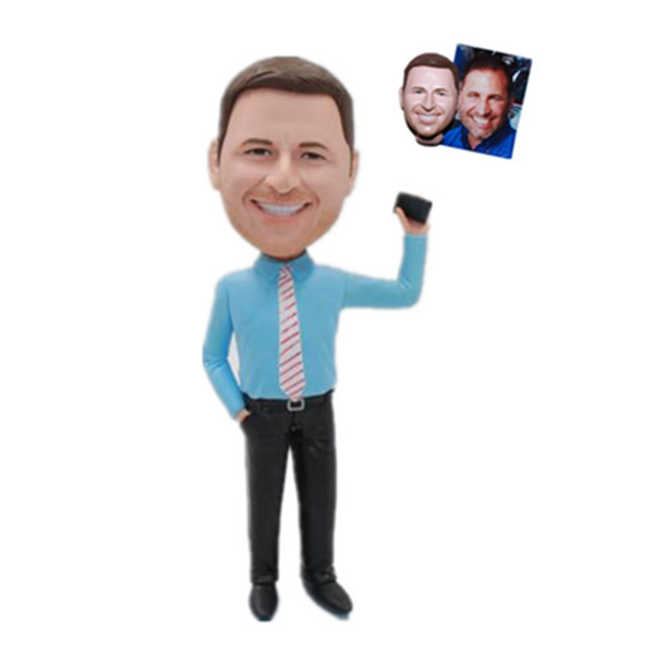 Businessman Bobbleheads Boss In Blue Shirt With Cellphone In Hand