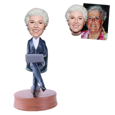 Female Boss Bobblehead Boss Sitting on Chair And Holding The Notebook